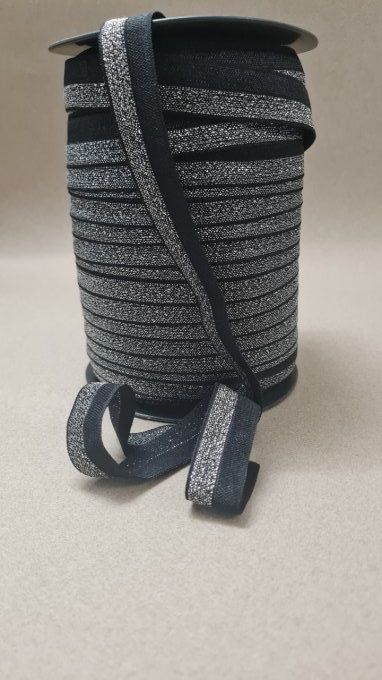 Biais élastique  pré-plié noir/argent 20mm au mètre