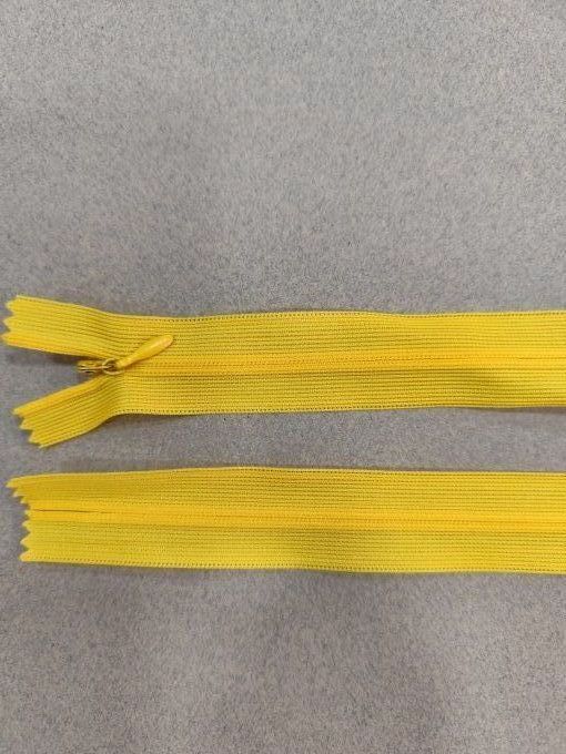 Fermeture éclair invisible jaune à la pièce